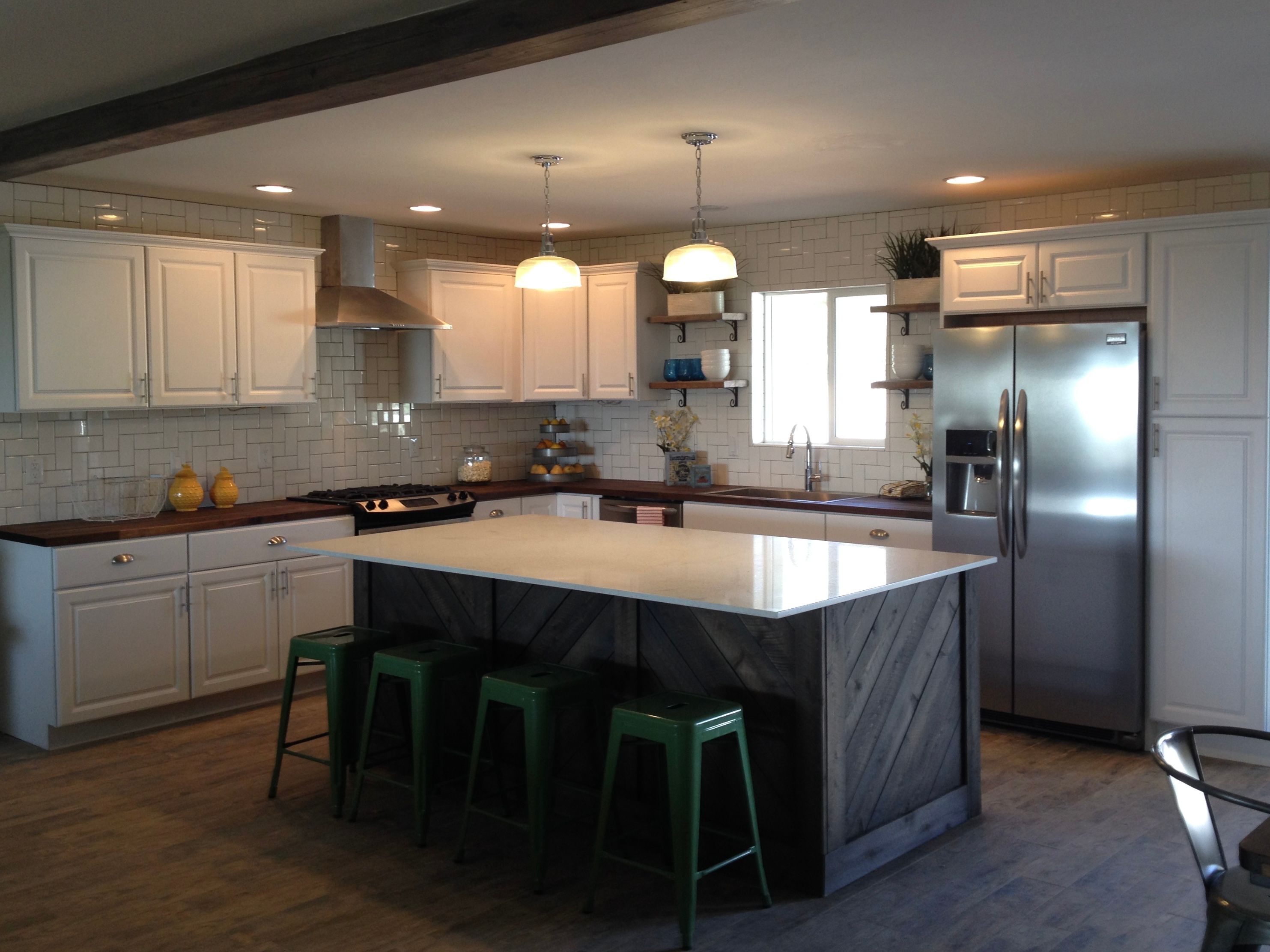 Quick $22,000 kitchen, including appliances, with inexpensive cabinets right off the racks at Home Depot, embellished with crown molding
