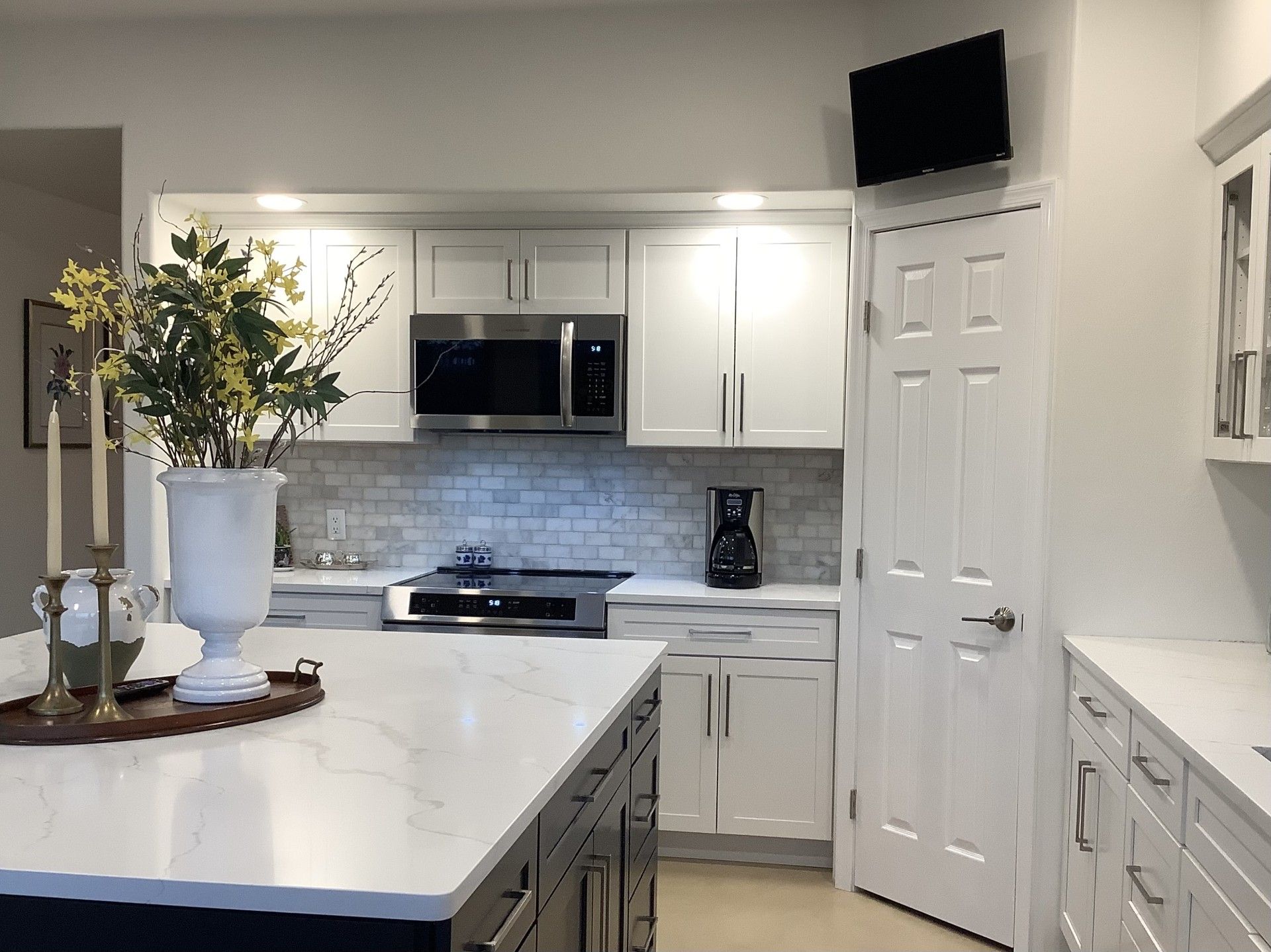 Work area with TV and high capacity corner pantry, instead of inefficient corner cabinets