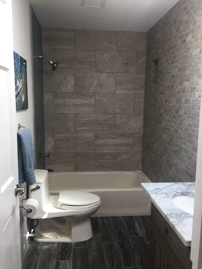 Guest bathroom with mixture of tile shapes, textures, and colors